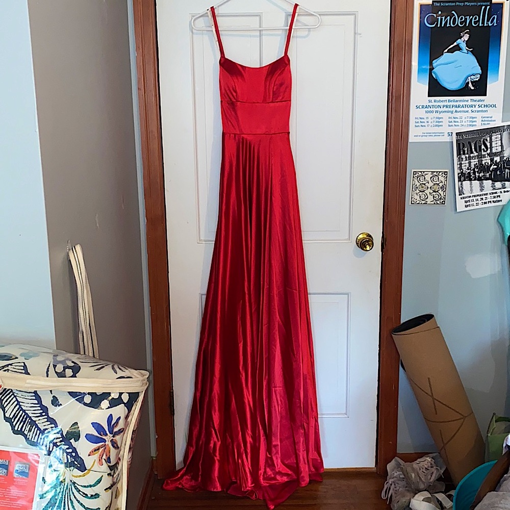 Red satin gown with slit-leg style and pockets